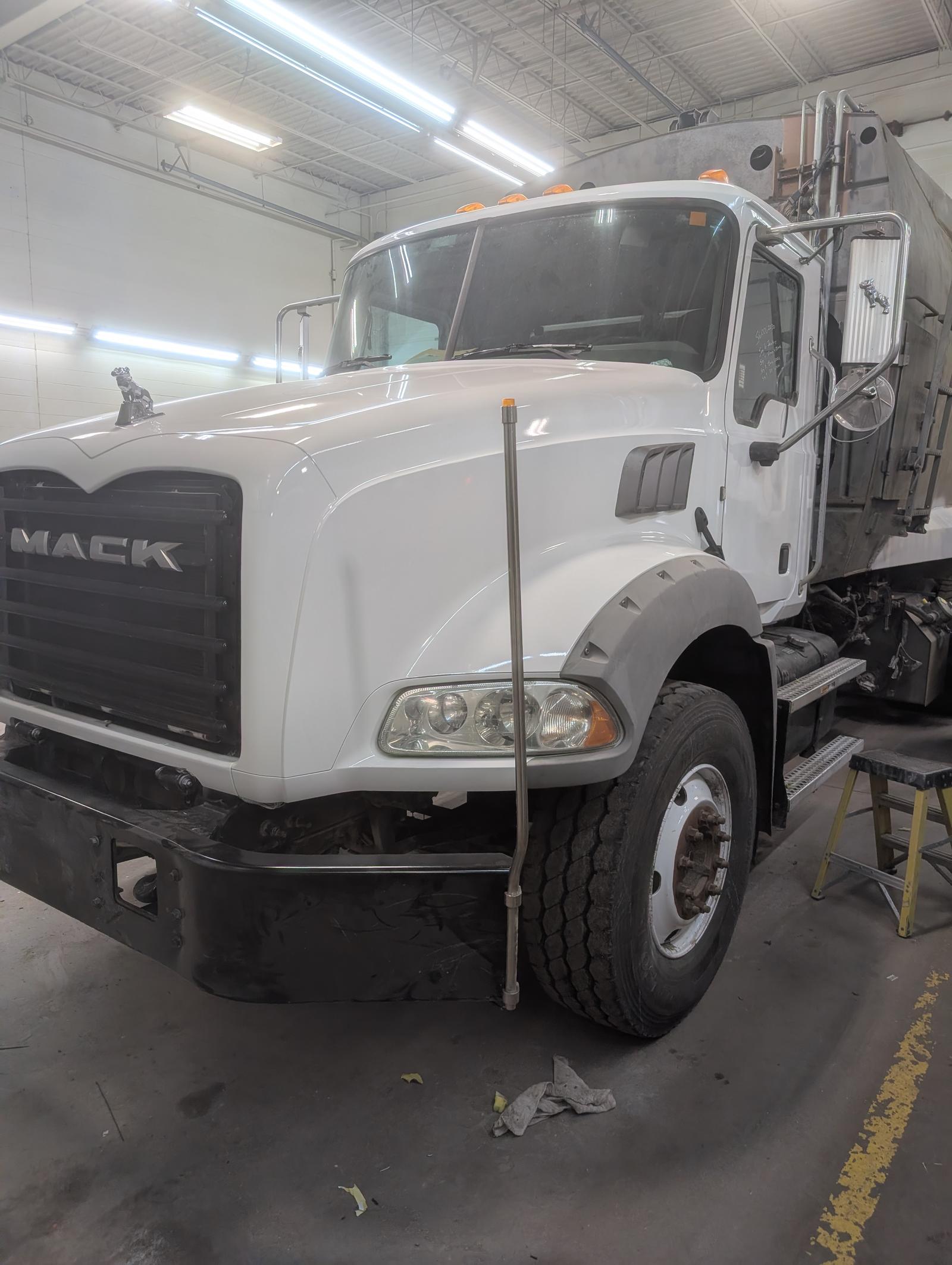White Mack commercial truck after refinishing