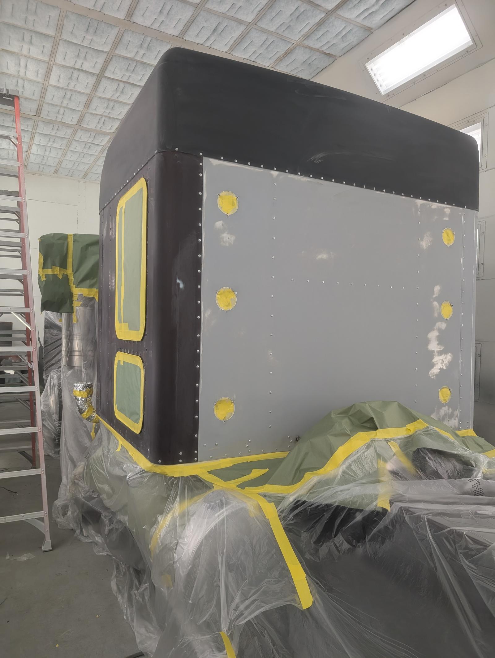 Truck sleeper cab masked and prepared for refinishing